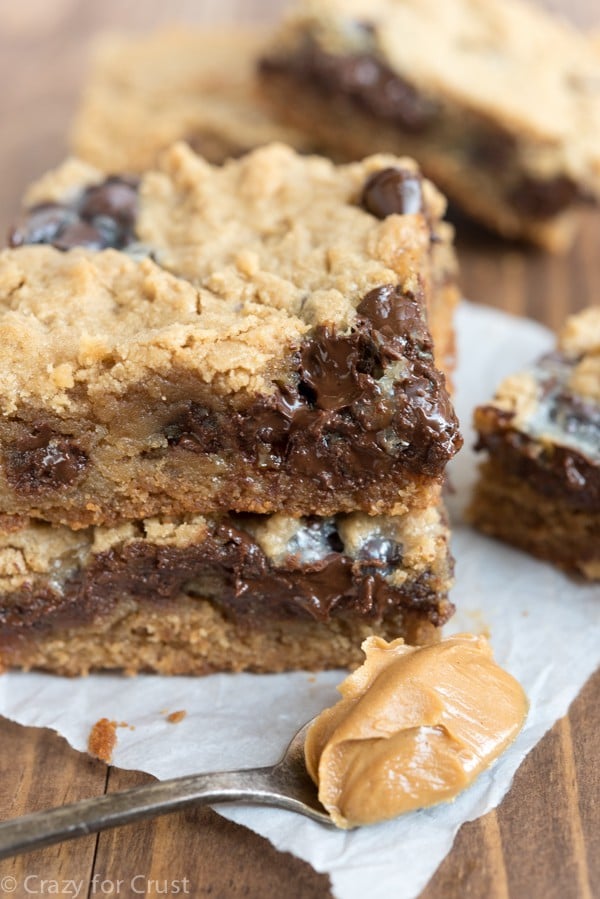 Peanut Butter Cookie Gooey Bars - my favorite peanut butter cookie recipe baked as a bar and filled with gooey chocolate and sweetened condensed milk!