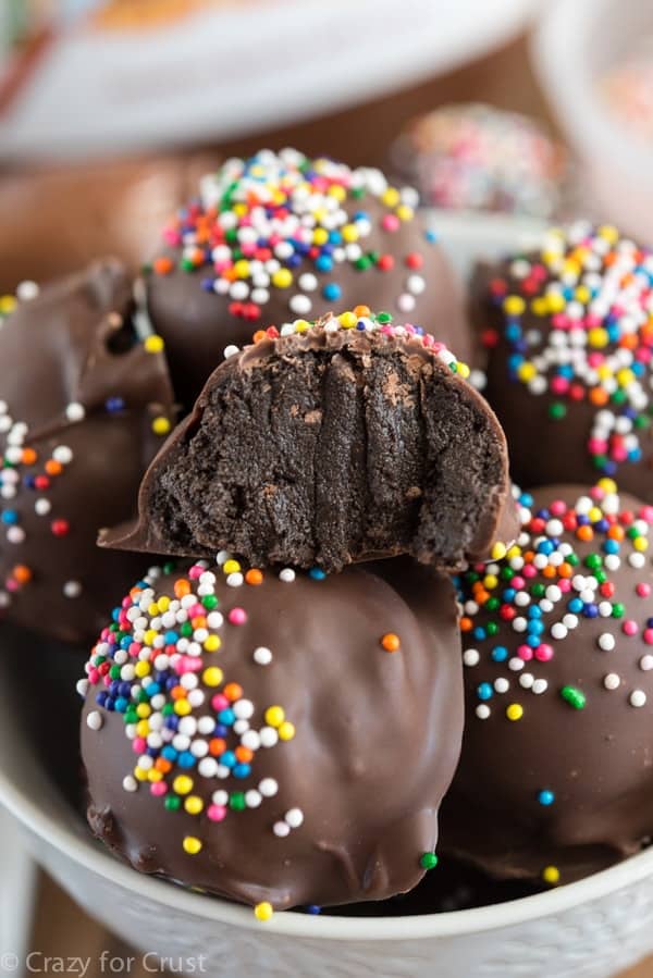 nutella truffle cut in half on stack of whole truffles