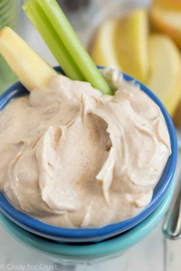 This Skinny Peanut Butter Dip is an easy, healthy recipe! Dip apples or veggies or crackers for breakfast, lunch, snack, or it's perfect for game day!