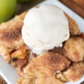 Overhead shot of snickerdoodle apple cobbler with vanilla ice cream scoop on top