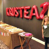 Picture of a women next to a Krusteaz sign