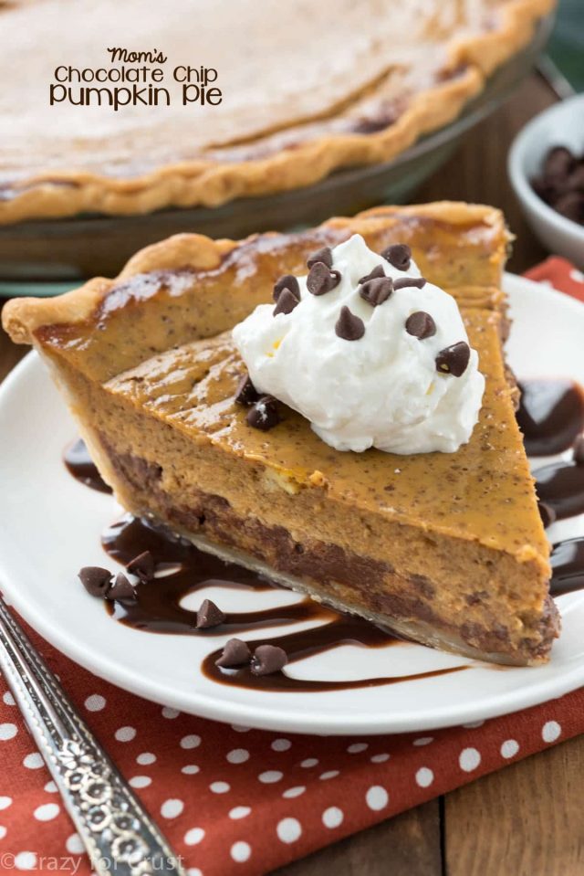 slice of pumpkin pie with chocolate chips on white plate with chocolate sauce