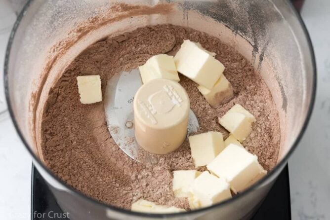 No Roll Chocolate Pie Crust being mixed in a food processor