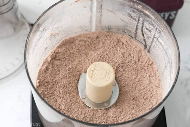 No Roll Chocolate Pie Crust being mixed in a food processor