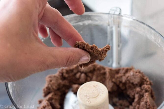No Roll Chocolate Pie Crust being mixed in a food processor