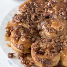Easy Caramel Pecan Rolls on a white plate