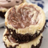 Close up Stack Mini Marble Cheesecake is chocolate graham cracker crust with chocolate and vanilla swirl cheesecake.