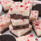 Table full of Oreo Peppermint Bark that has an oreo-fudge layer and peppermint layer.