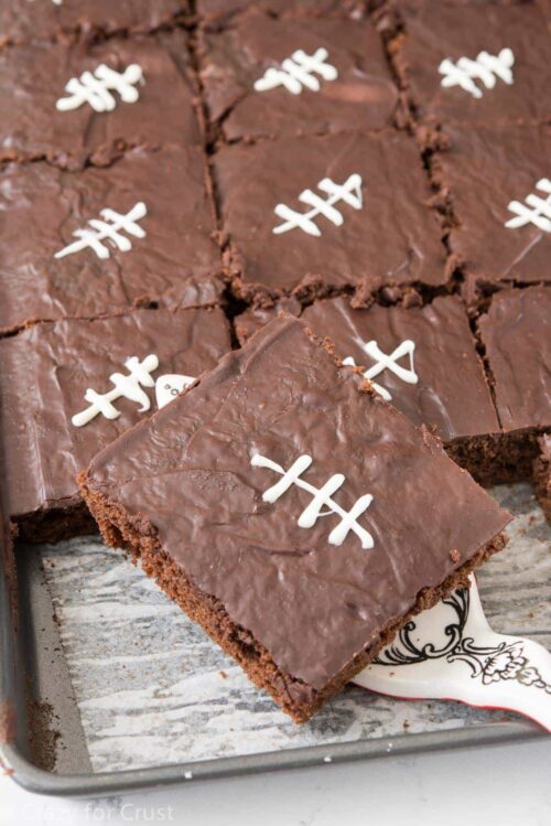 Football cake pieces on a cookie sheet