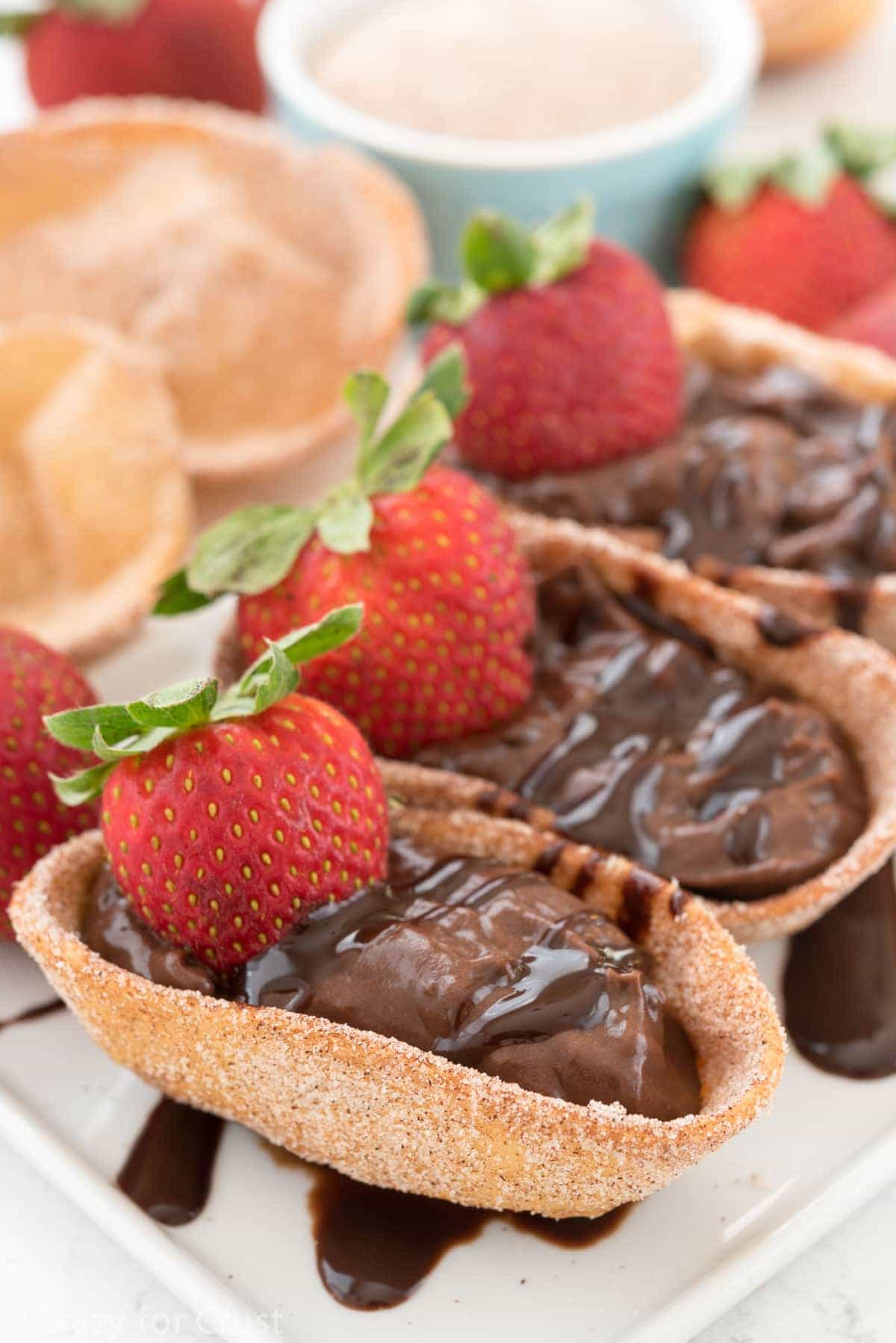 Chocolate Churro Pies topped with fresh strawberries
