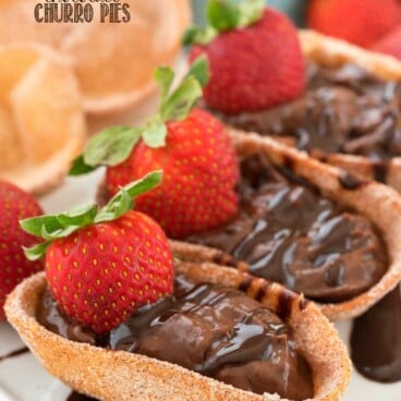 Chocolate Churro Pies topped with fresh strawberries