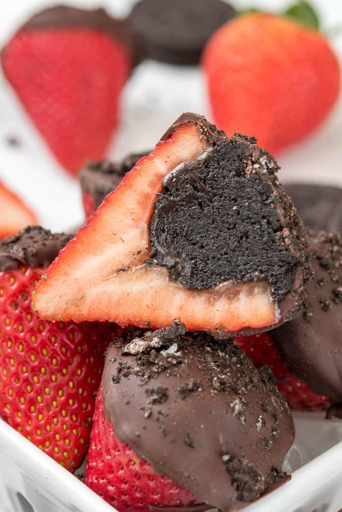 Oreo Truffle Dipped Strawberries - an easy Valentine treat! Stuff strawberries with Oreo Truffles and dip the tops in chocolate!