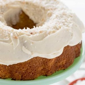 Coconut carrot cake on mint green cake stand