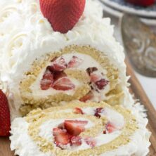 Strawberry shortcake cake roll with one slice cut