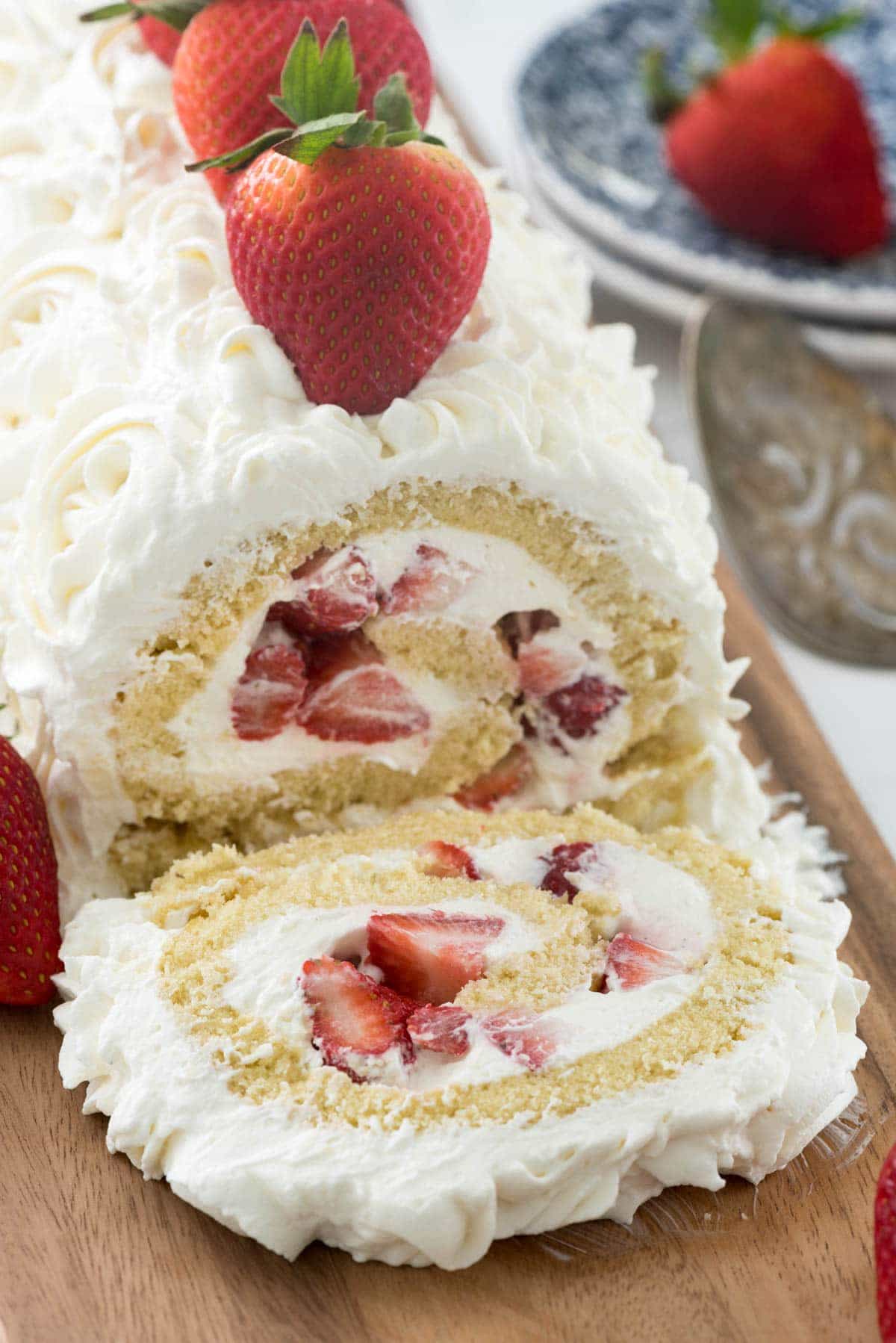 Strawberry Shortcake Cake Roll - this easy strawberry shortcake filled with cream cheese whipped cream! Everyone loves this easy cake recipe.