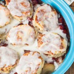 Overhead shot of easy cinnamon roll cobbler in light blue baking dish