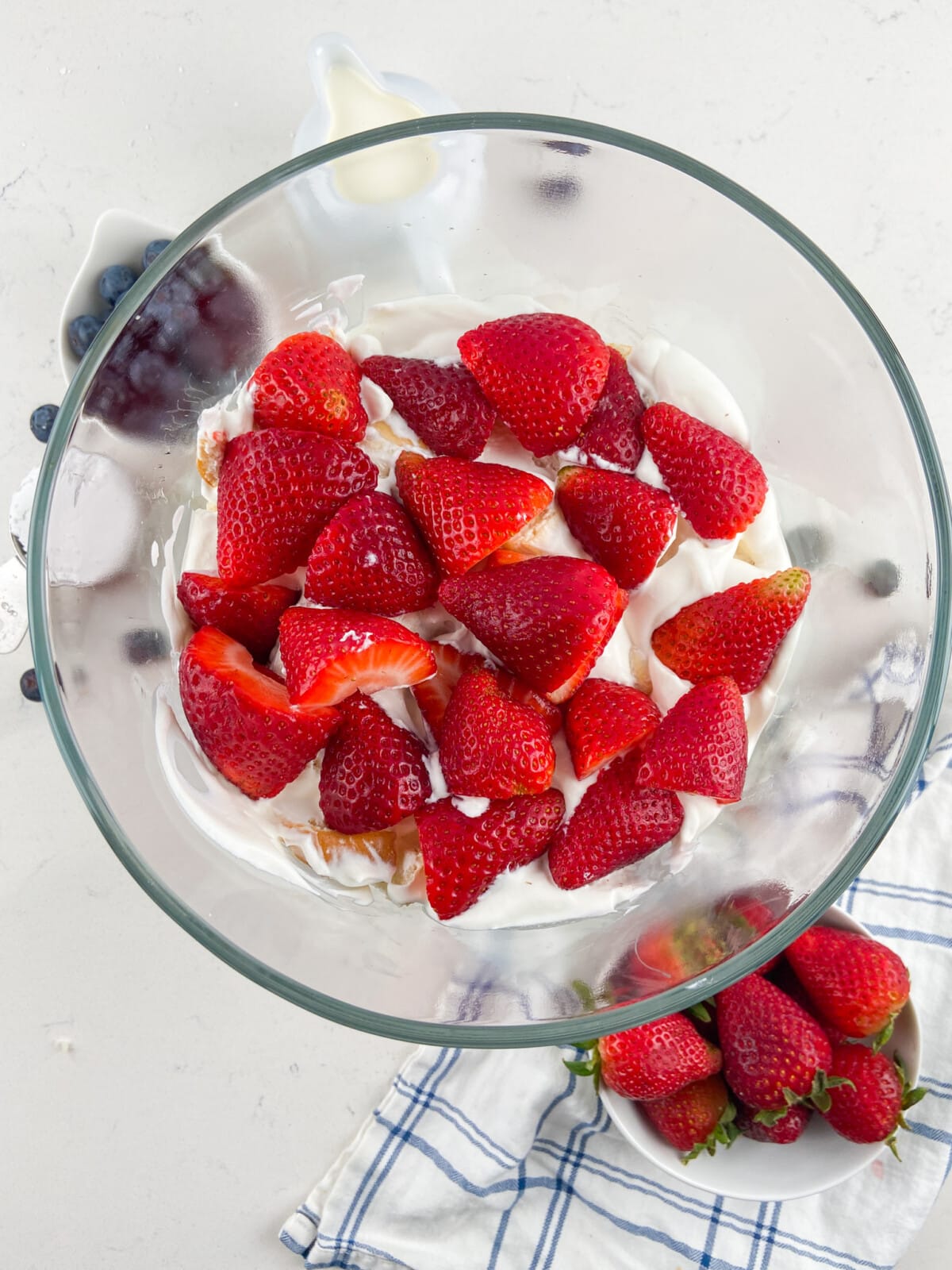 trifle dish with cream and strawberries.