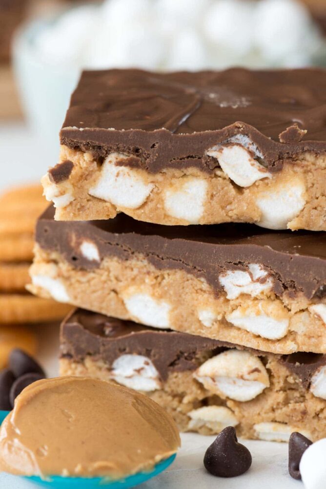 s'mores peanut butter bars stack with a spoonful of Peanut butter 