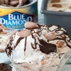 No churn almond fudge ice cream in a clear dish with almonds in the background