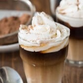 Close up of sweet cream shooter with whipped cream on top