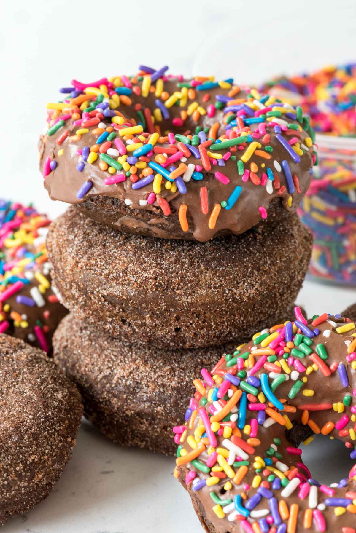 Baked Chocolate Donuts - this recipe is the perfect donut recipe! It's light and fluffy and they're served up glazed or cinnamon sugar churro style!