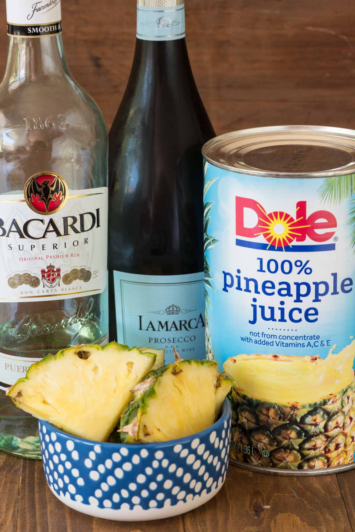 bottles of rum, prosecco and pineapple juice