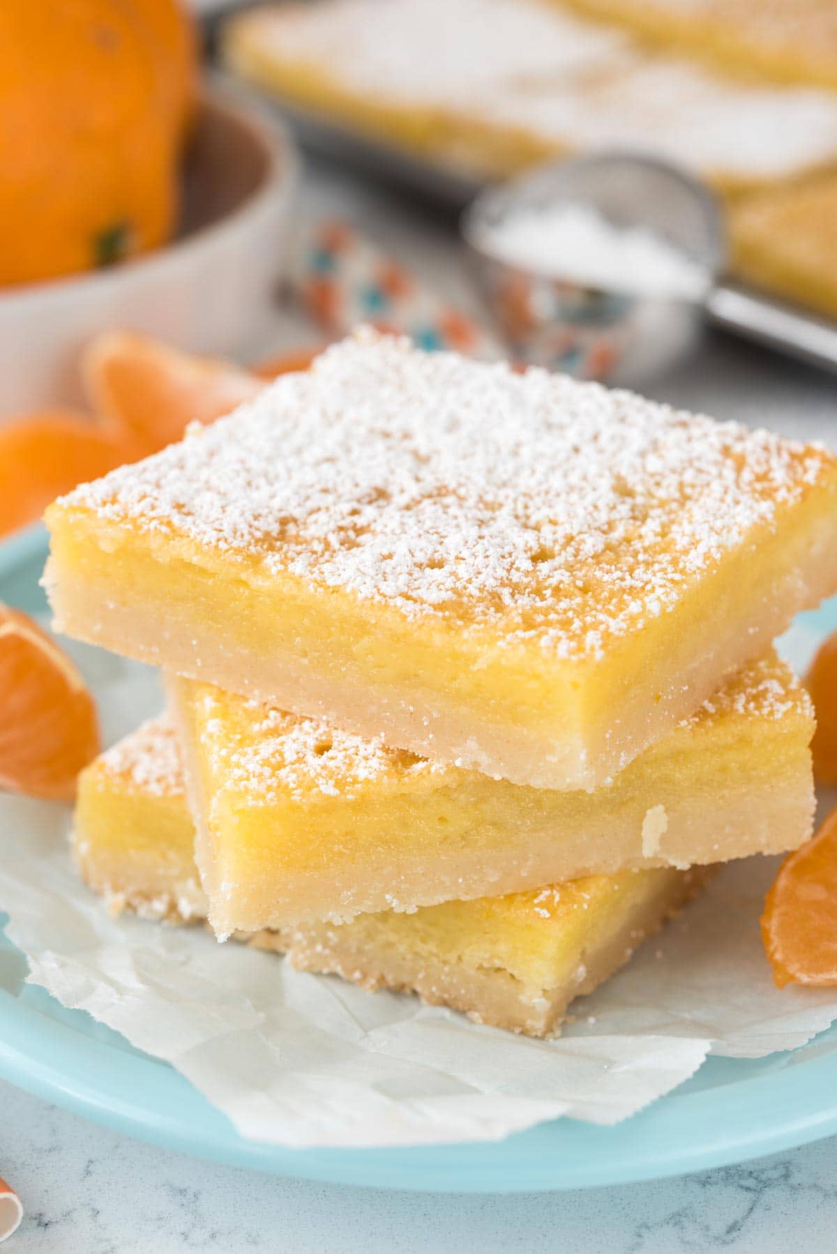 Orange Dream Bars - this easy recipe is like a lemon bar but with orange! Sweet and tart, they're the perfect dessert recipe!