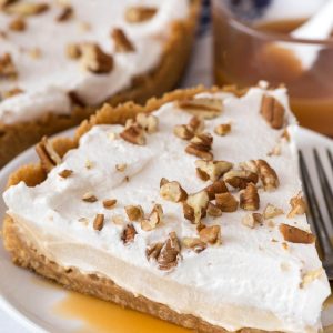 Slice of no bake butterscotch pie on white plate