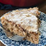 Apple fritter coffee cake slice on blue and white plate