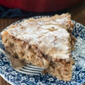 Apple fritter coffee cake slice on blue and white plate