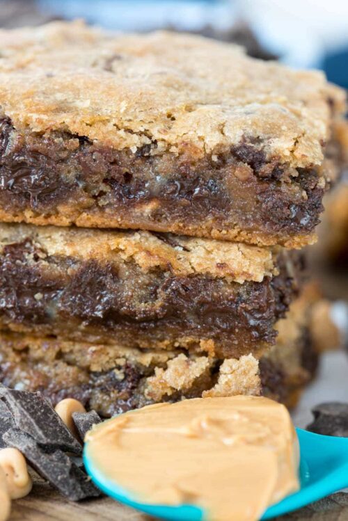 Stack of peanut butter bars and a spoonful of Peanut Butter