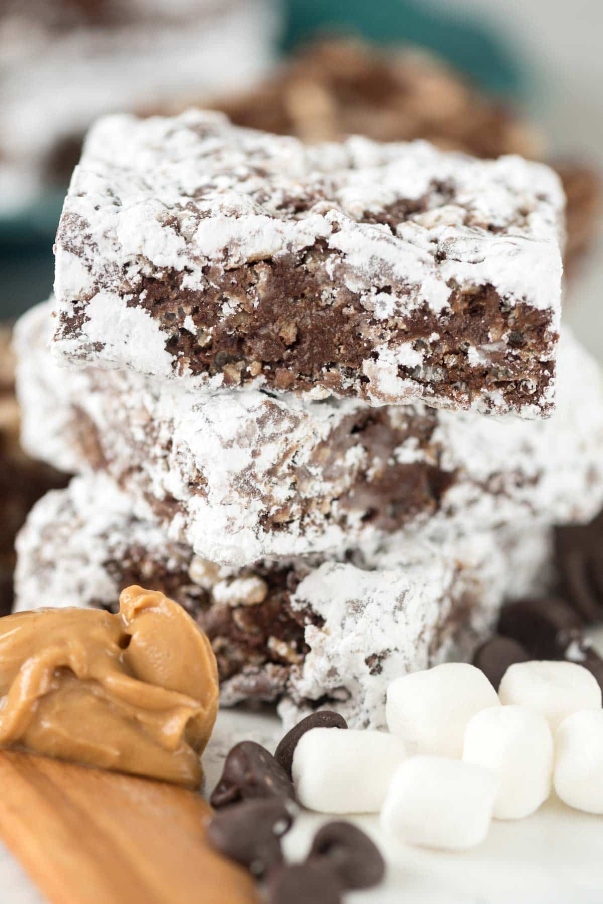 Easy Muddy Buddy Krispie Treats - peanut butter chocolate cereal treats coated in powdered sugar!