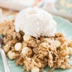 Pumpkin spice oatmeal bars on light green plate with ice cream scoop
