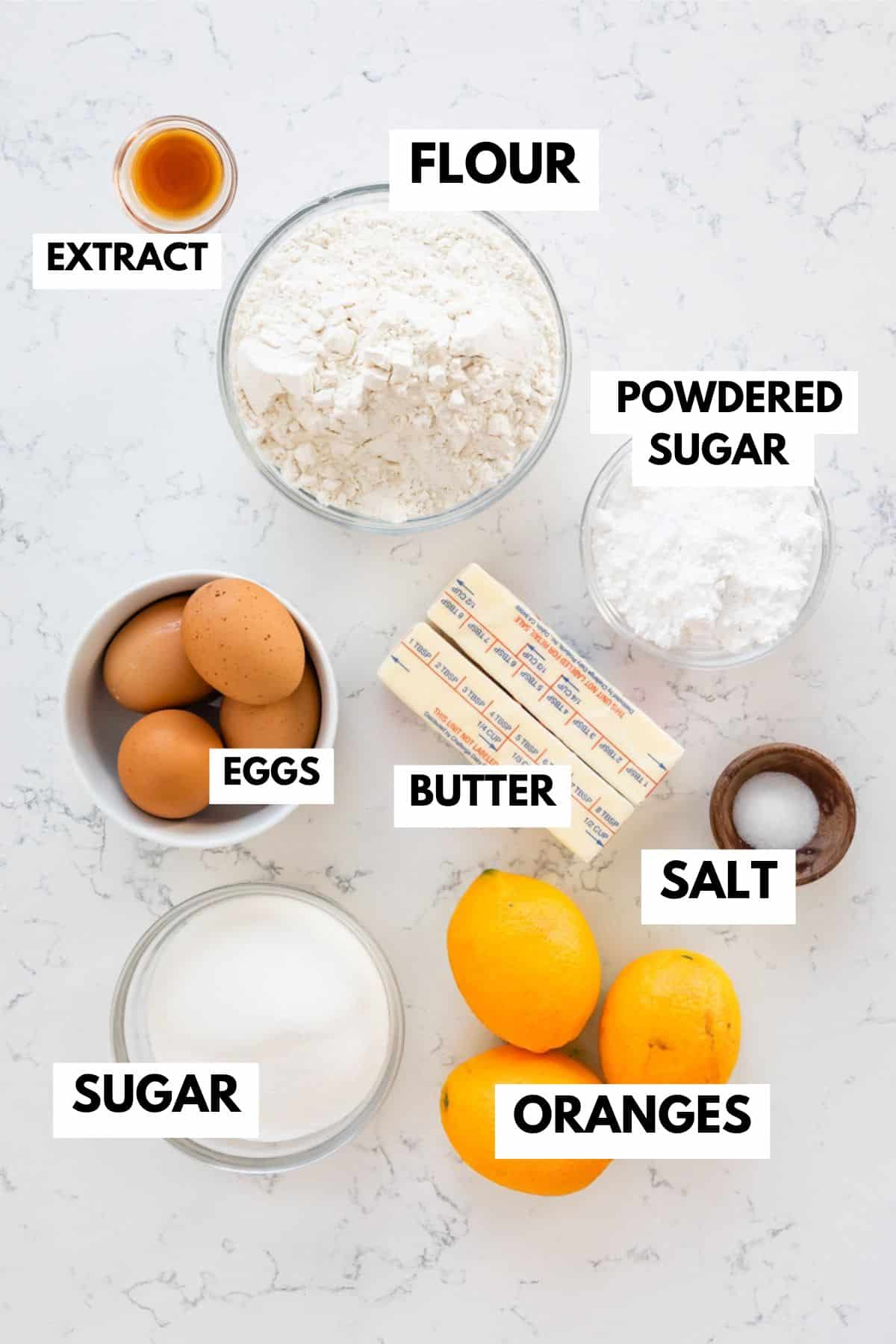 Top-down view of baking ingredients for Orange Dream Bars on a marble surface, labeled: flour, powdered sugar, extract, eggs, sugar, butter, salt, and oranges. Each item is placed in a bowl or container, neatly arranged.
