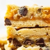 stack of three cookie bars with words on photo.