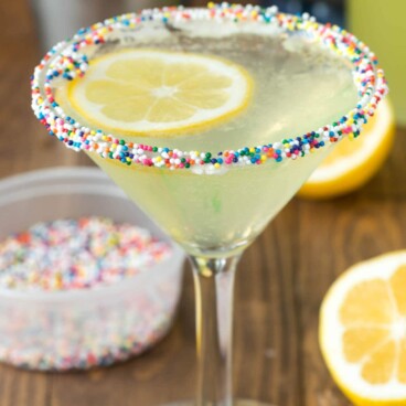 Lemon cupcake martini with rainbow sprinkles on rim
