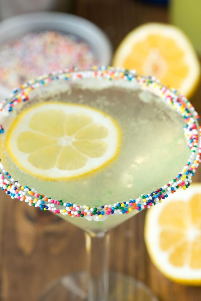 Lemon Cupcake martini in a Martini Glass with sprinkles on the rim
