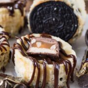 Mini snickers cheesecakes with snickers candy on top