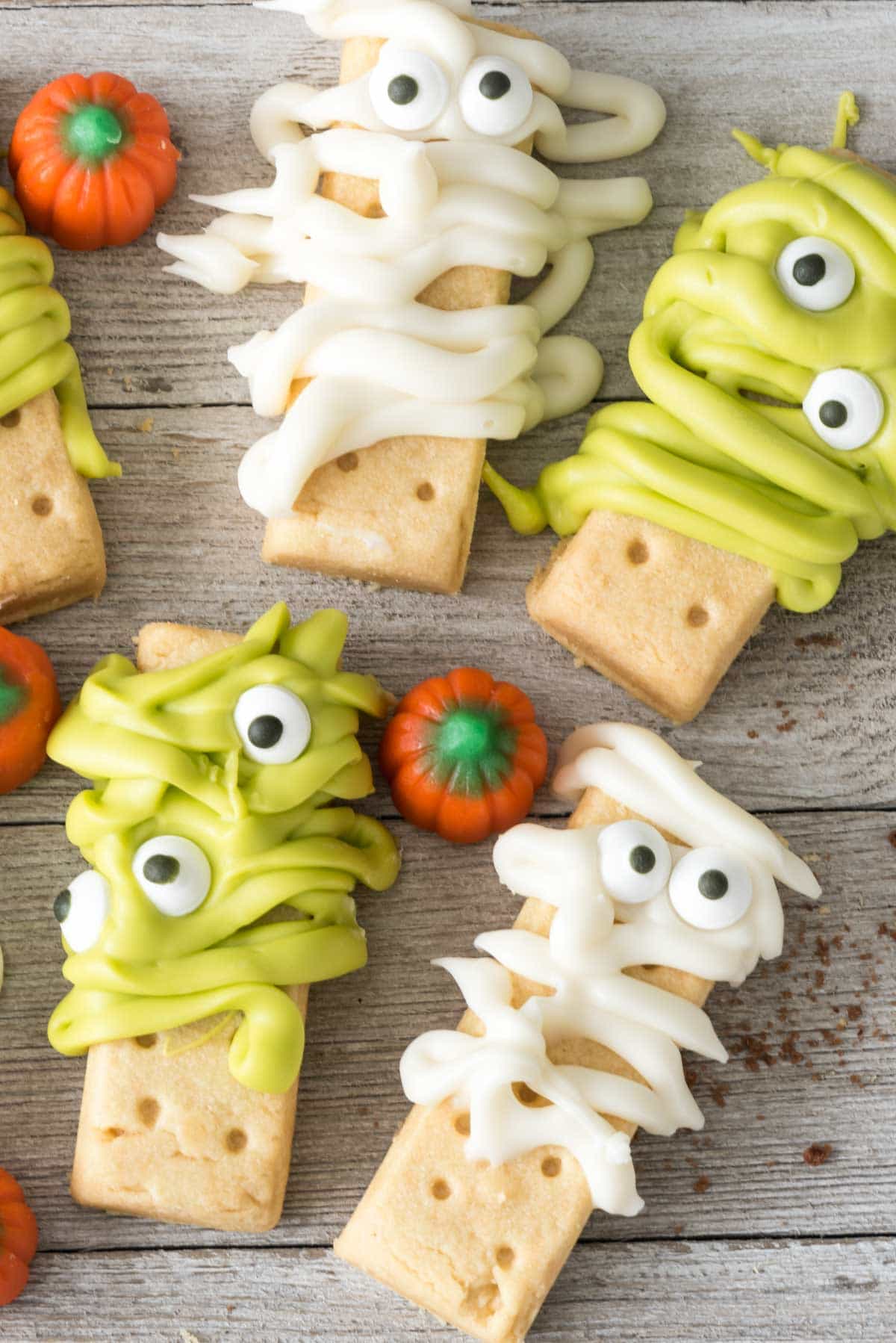 Monsters and Mummies made out of shortbread cookies and melted candy. The eyes make them so fun!