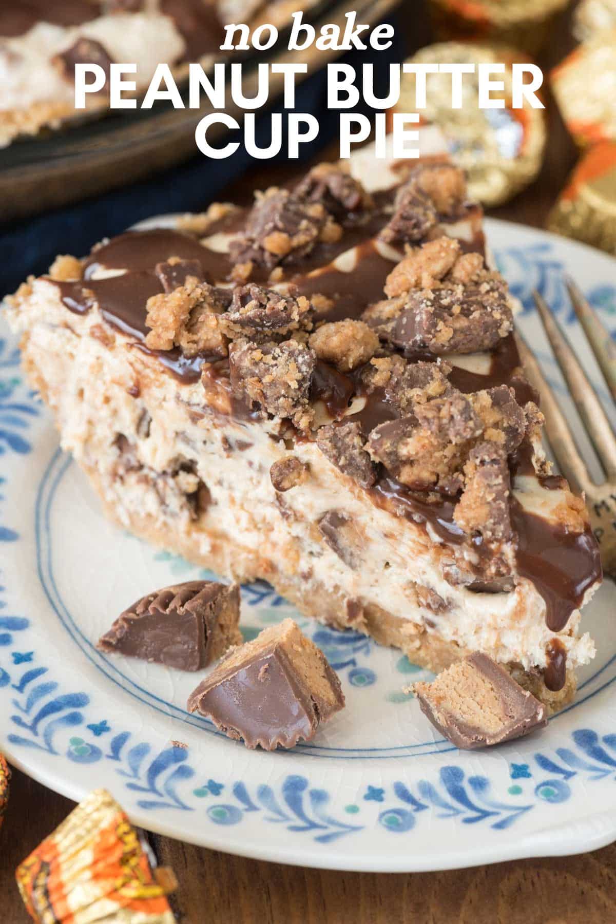 A slice of no-bake peanut butter pie recipe masterpiece rests on a plate. This indulgence features a creamy filling blended with chocolate and peanut butter cup pieces, topped with a chocolate drizzle and crumbled cups. A fork lies invitingly beside the delectable slice.
