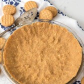 Overhead shot of peanut butter cookie crust on kitchen counter