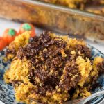 Piece of pumpkin hot fudge cake on blue plate with fork