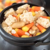 Close up of halloween snack mix in small halloween cauldron