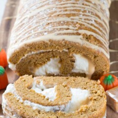 Caramel Pumpkin Cake Roll - an easy pumpkin roll cake filled with caramel ganache and cream cheese whipped cream. This is the BEST pumpkin roll recipe!