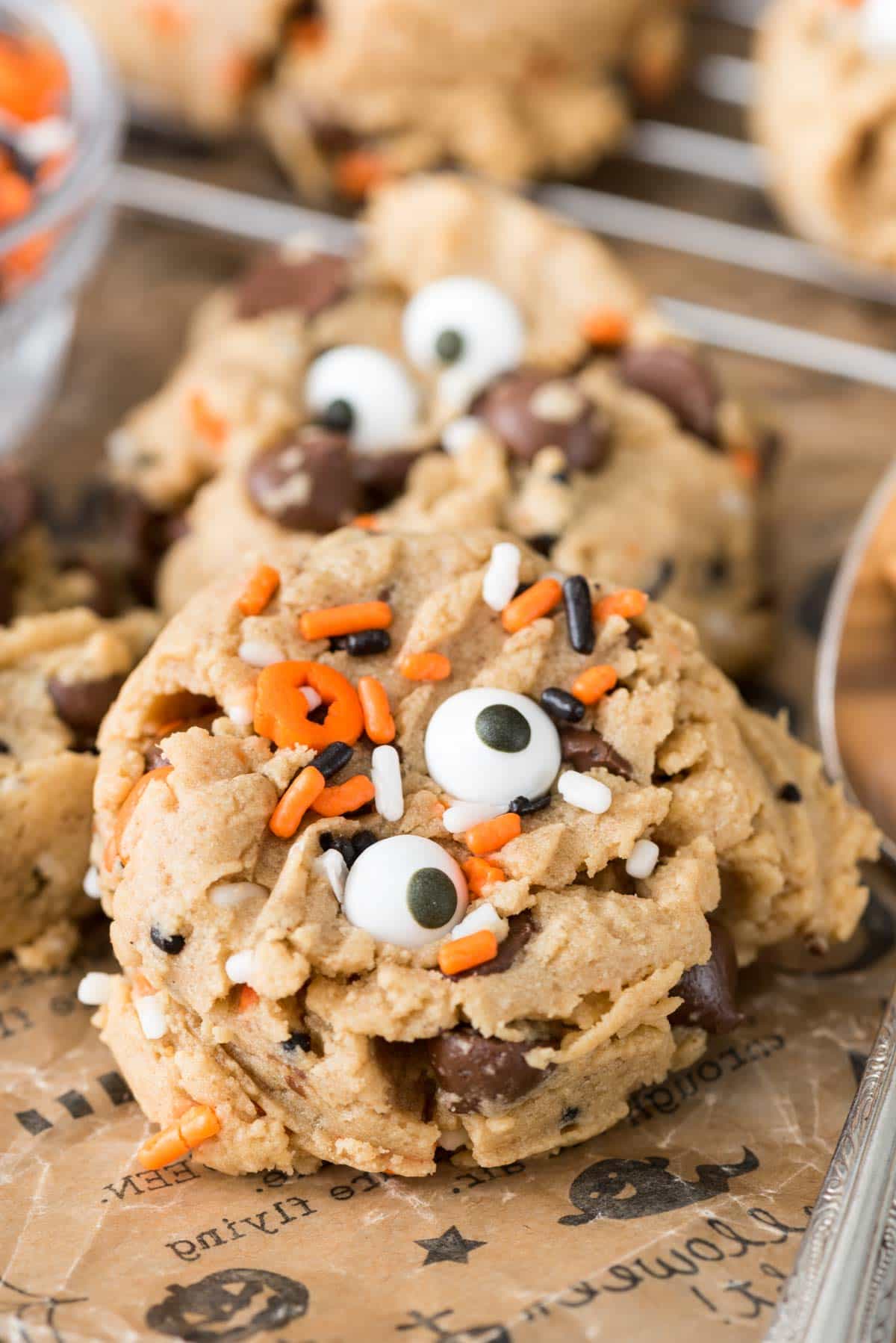 Monster Peanut Butter Pudding Cookies - this easy peanut butter cookie recipe has pudding in the dough so they stay soft for days! Add chocolate chips and a cute monster face for Halloween!