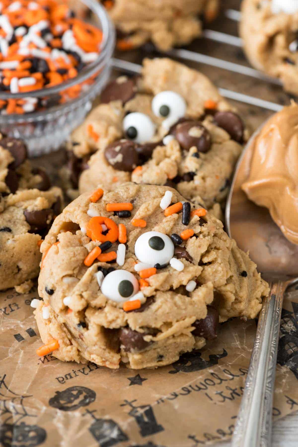 pudding cookies with orange and black sprinkles and candy eyes baked in.