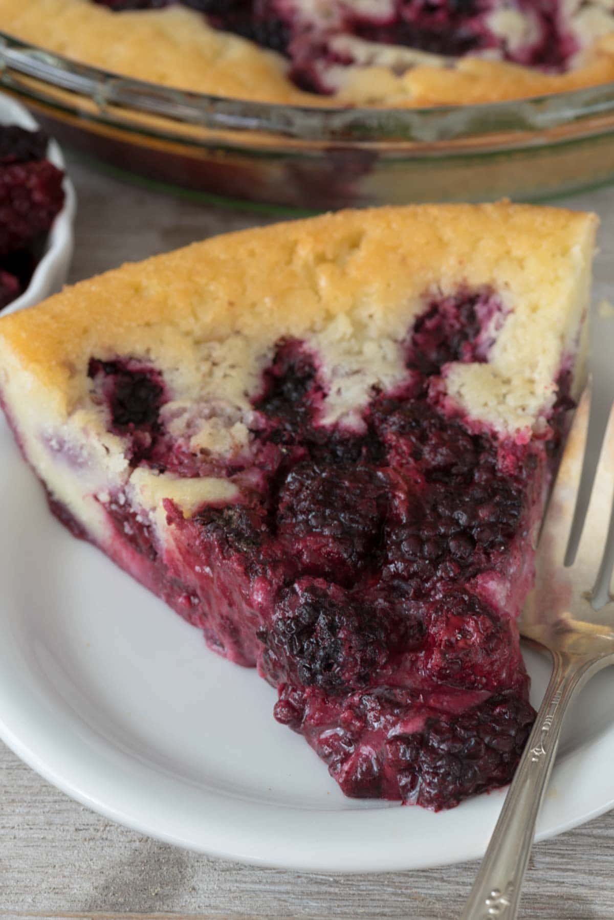 Crazy Crust Berry Pie - this EASY pie recipe makes its own crust! It's a cross between a cobbler and a pie and it's perfect for people who aren't crazy about crust.