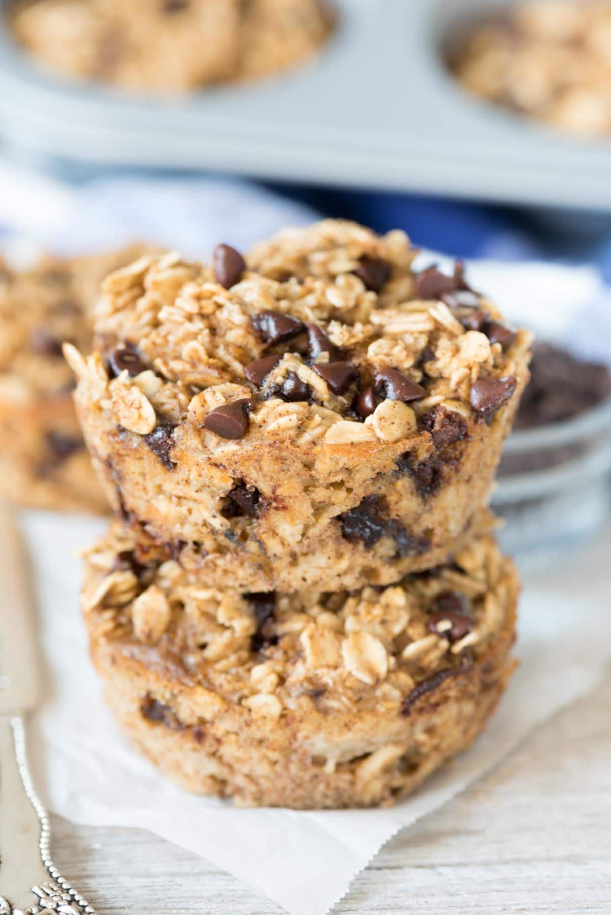 Chocolate Chip Baked Oatmeal Muffins - this EASY breakfast recipe is great for on the go! It's a healthier muffin that's dairy free and has no oil or flour but tastes like an amazing chocolate chip dessert!