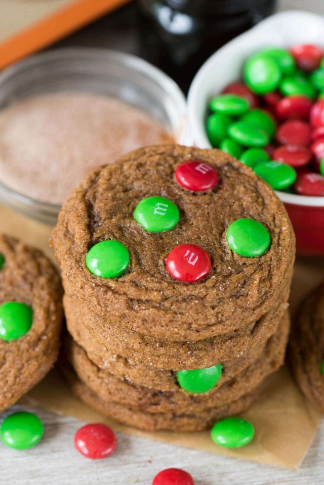 stack of molasses cookies with Christmas M&Ms