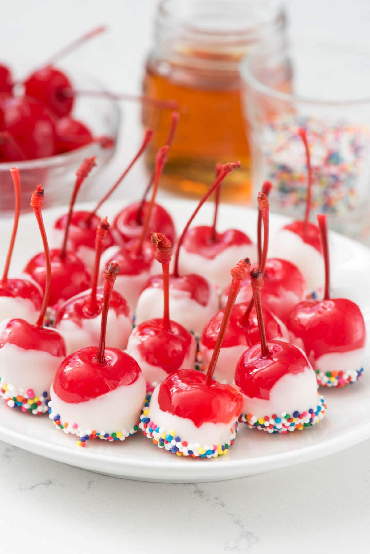 Easy Drunken Cherries - this recipe has just 4 ingredients! Dip alcohol soaked cherries in chocolate for a quick party dessert!